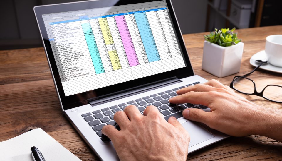 Person's Hand Using Laptop